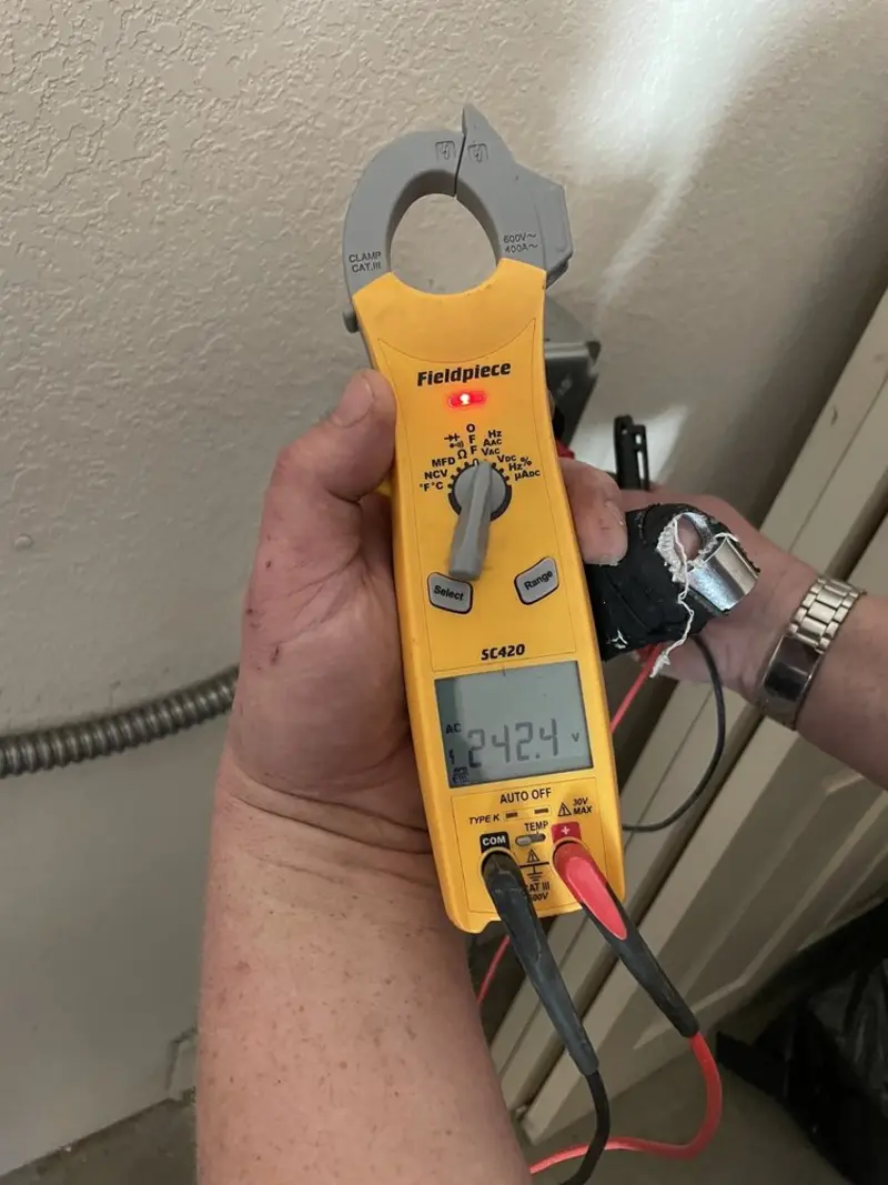 Voltage testing with clamp meter during Outlet Installation in Leavenworth